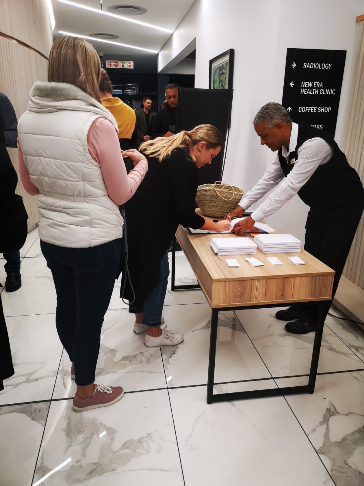 Delegates signing in at the registration desk of a MedTalk Network CPD event