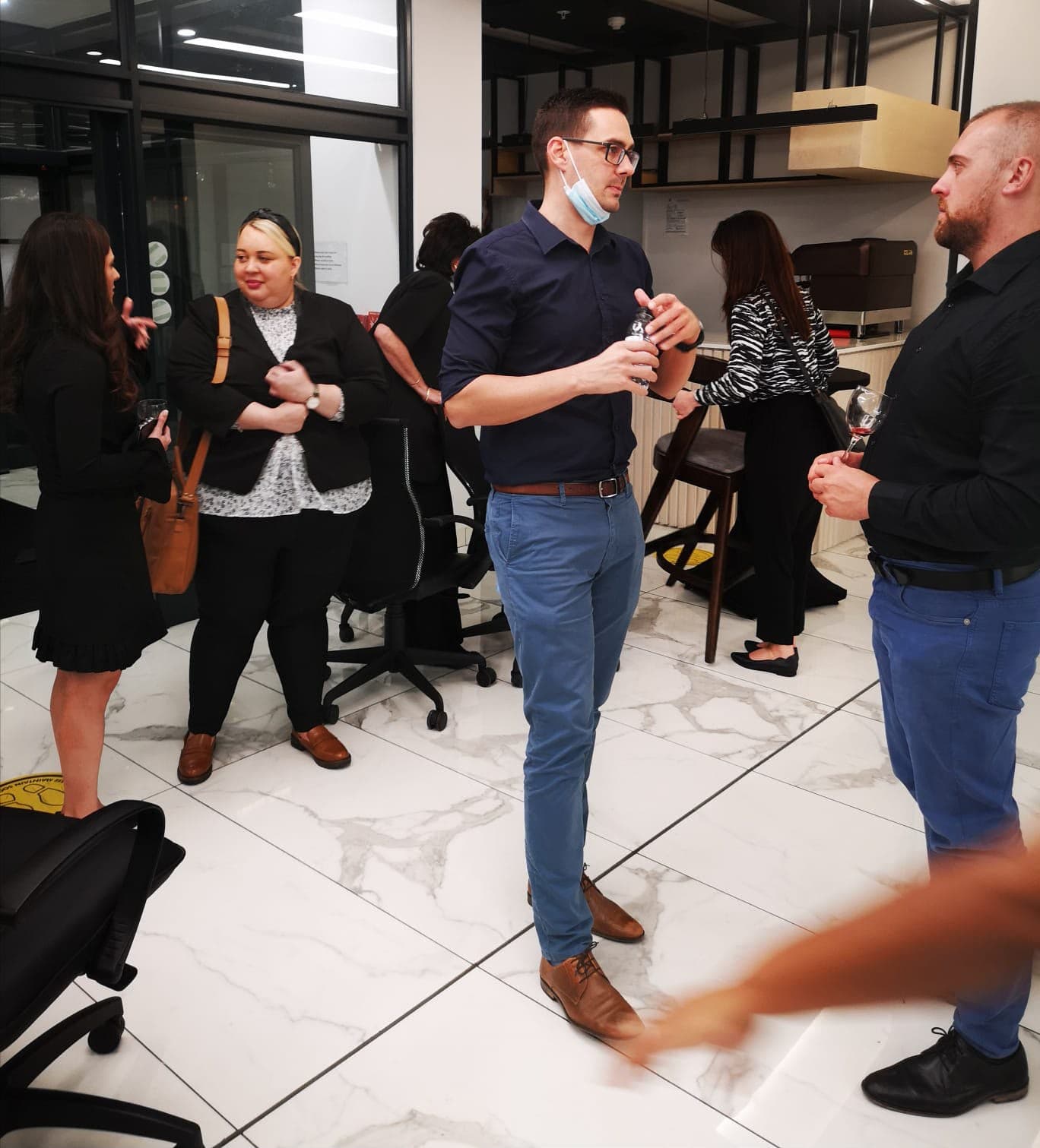 Healthcare professionals talking and networking at a MedTalk Network evening event